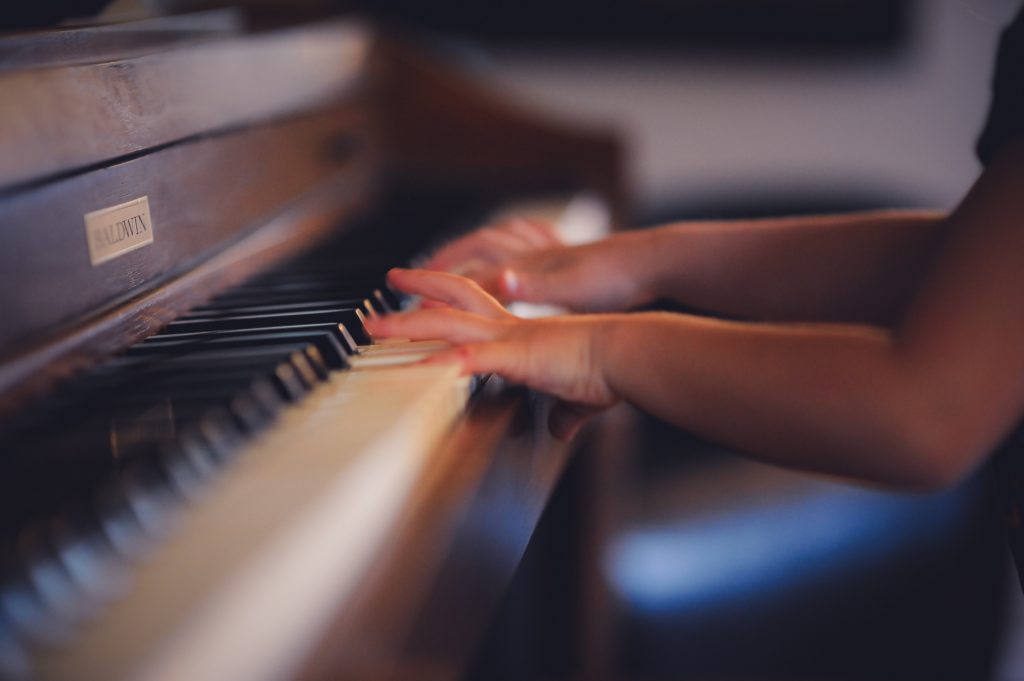 Child practices piano