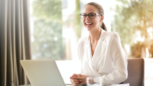 woman smiling at laptop