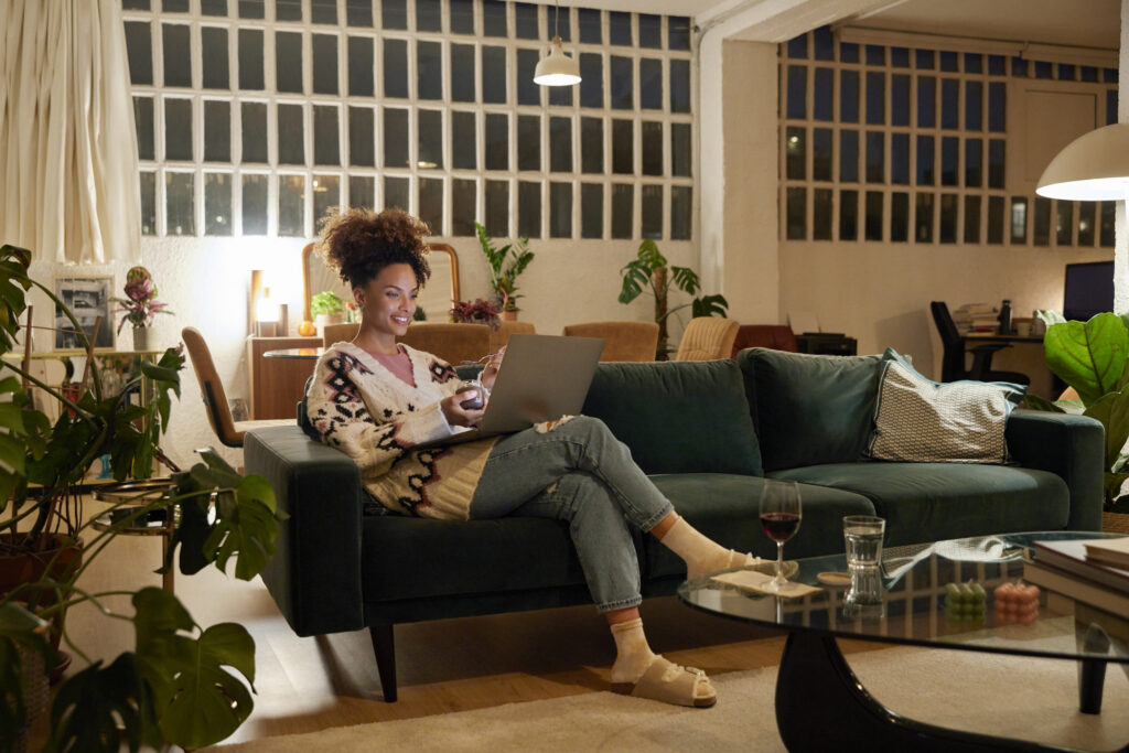 woman watching video on couch