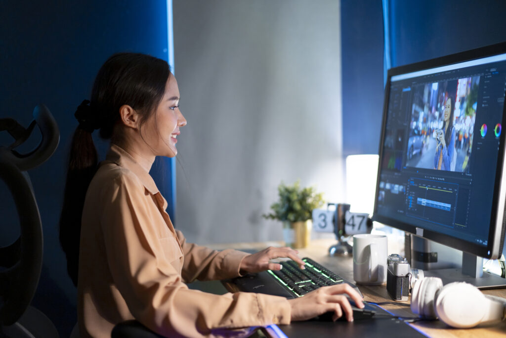 Female Video Editor Works with Footage on Her Personal Computer, She Works in Creative Office Studio.