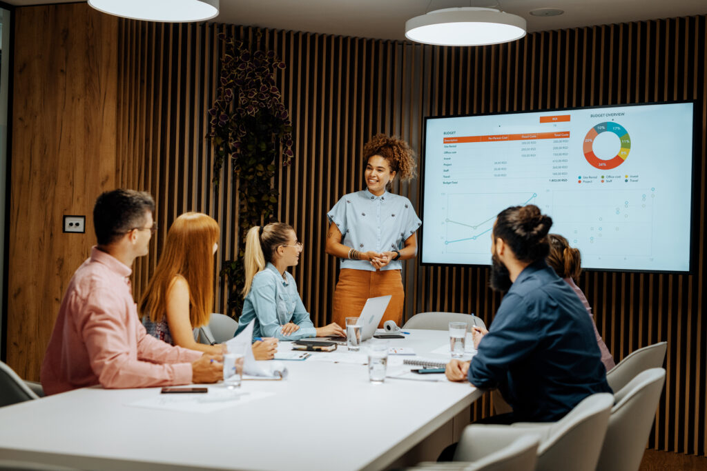 Presentation during business meeting - business person showing financial figures