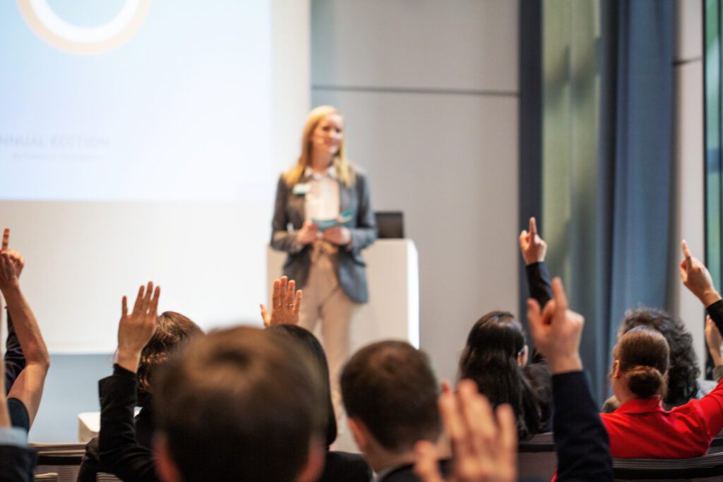 women standing in front of an audience and presenting