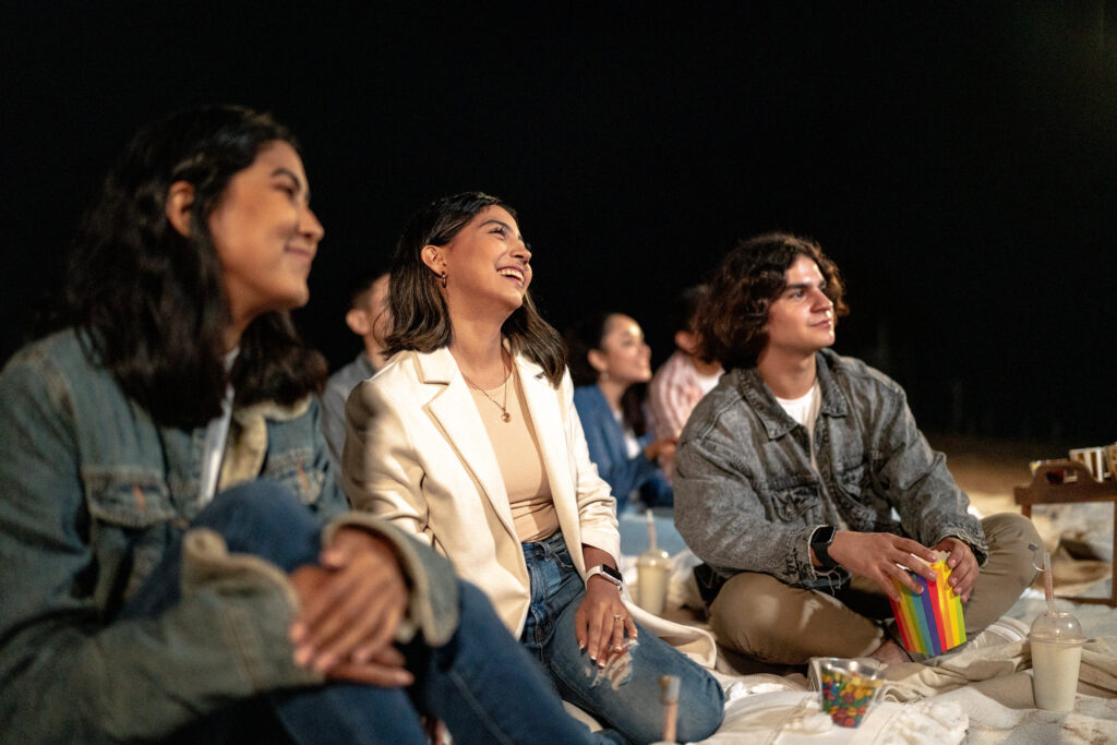 Group of friends watching presentation night ideas