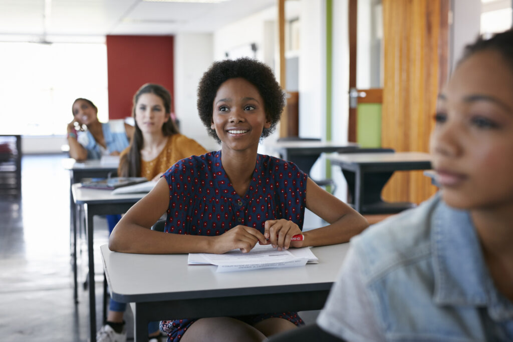 Female student looking up in classroom