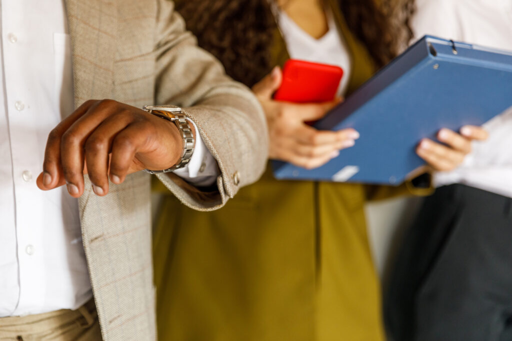 Cut out shot of diverse group of young business people standing in line against a wall, each preparing differently for a job interview meeting.