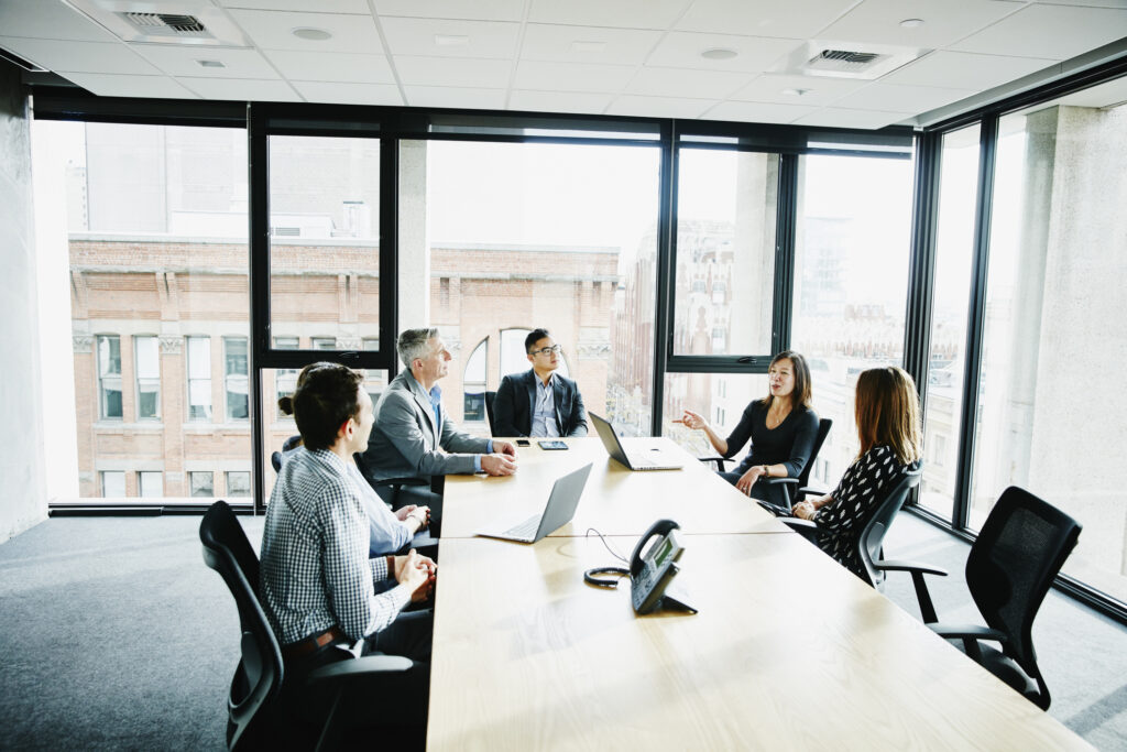 Businesswoman leading project meeting in office conference room