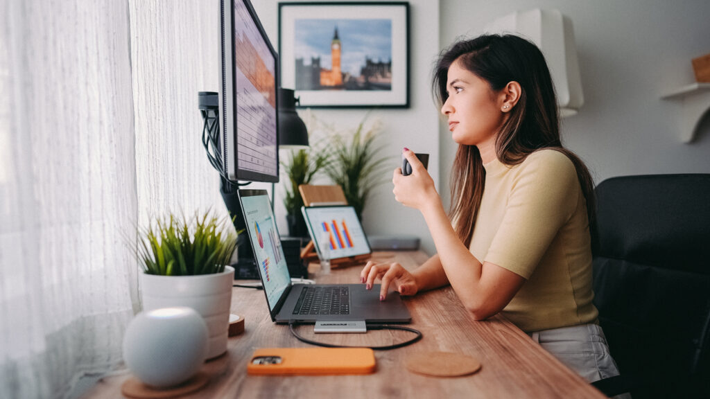 Businesswoman working at home with AI efficiency tools.