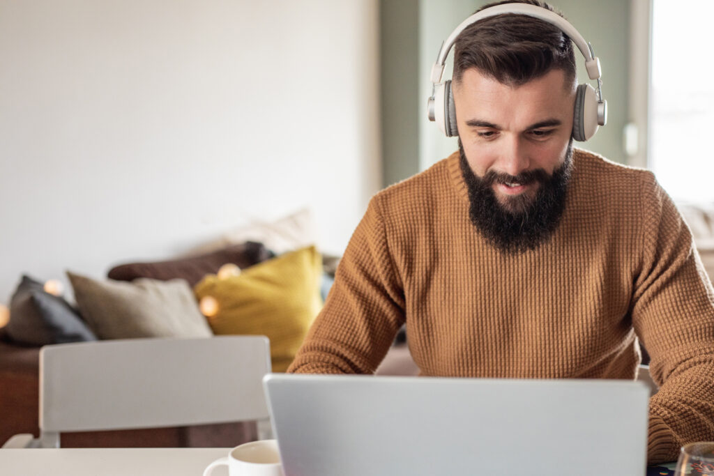 Modern man is working from home, he is listening to online content