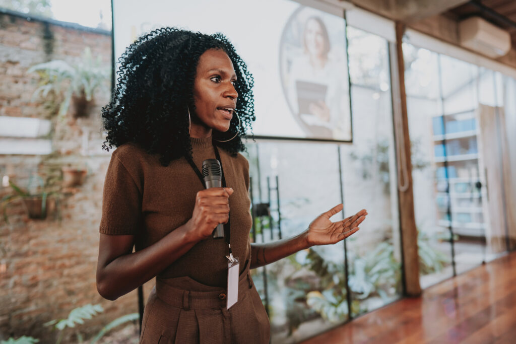 Woman giving branding presentation.