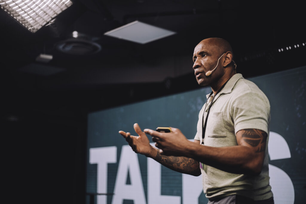 Male public speaker using the storytelling presentation style.