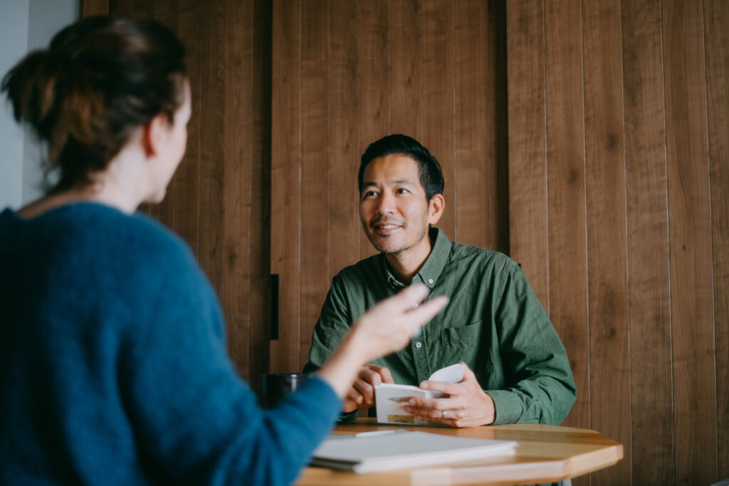 Man and woman having a small business meeting in smart casual clothes