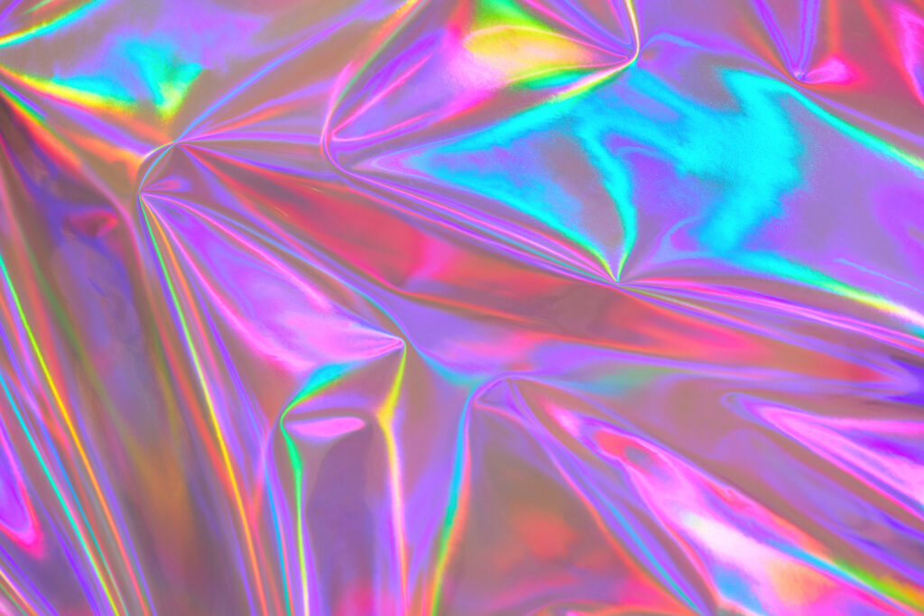 Abstract holographic background 80s, 90s, 2000s style. Modern surreal pastel neon purple, hot pink, blue metallic dreamy optimistic kawaii crumpled holographic foil texture. Candy colors, dreamlike, retro futurism concept