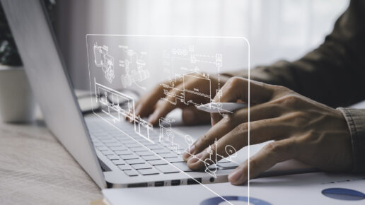 Engineer Working on desktop computer, displaying a software control panel with a screen showing CAD, a machine learning assembly process.