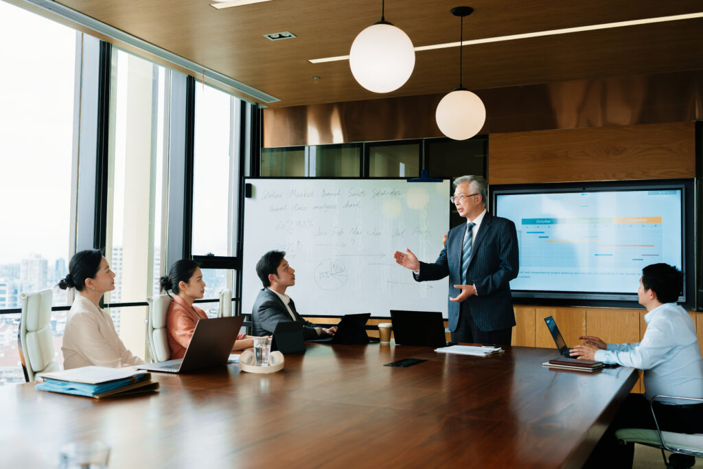 Man presenting in front of an audience